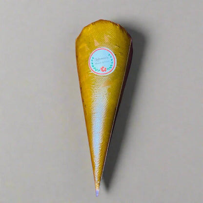 Single henna cone with label on neutral background, ready for temporary body art designs
